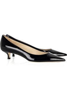 a pair of black patent leather high heels with a kitten heel and a pointed toe. they are elegant and classic, perfect for formal occasions.