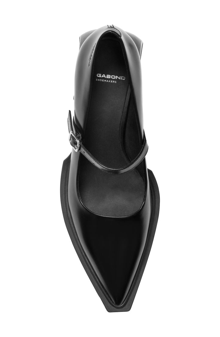 a closeup, overhead shot of a single black women's mary jane style shoe with a pointed toe and a thin strap across the instep.  the shoe is made of leather and has a slight heel. the brand "gabond shoemakers" is visible on the insole. the background is white.