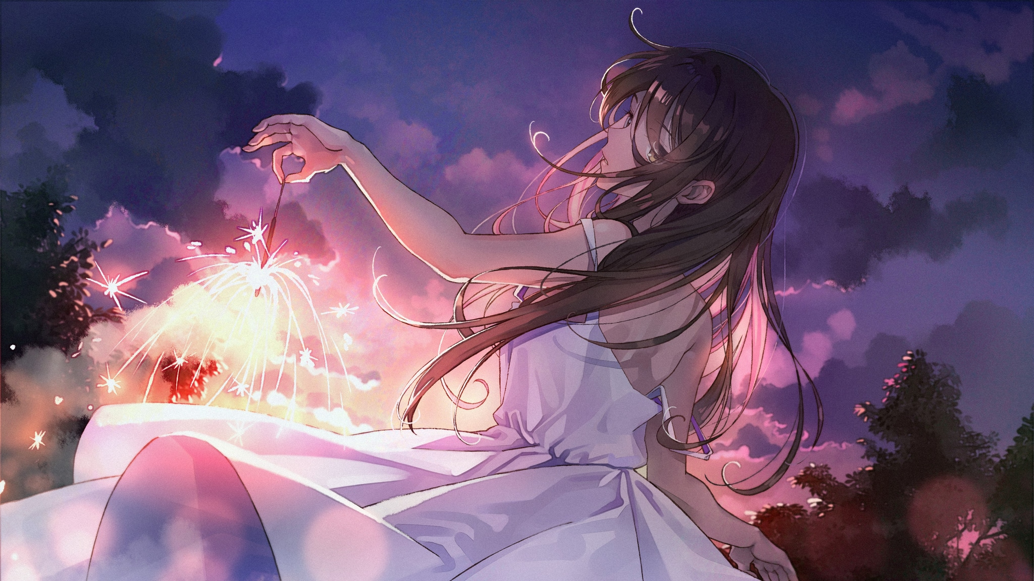 the image depicts an anime girl with long brown hair wearing a flowing white summer dress. she is sitting outdoors, holding a lit sparkler, gazing up at a vibrant sunset or twilight sky filled with clouds.  fireworks are bursting in the background, adding to the magical and dreamy atmosphere of the scene. the overall style is soft and romantic, with a focus on light and color. the artwork is digitally created, with a painterly quality.