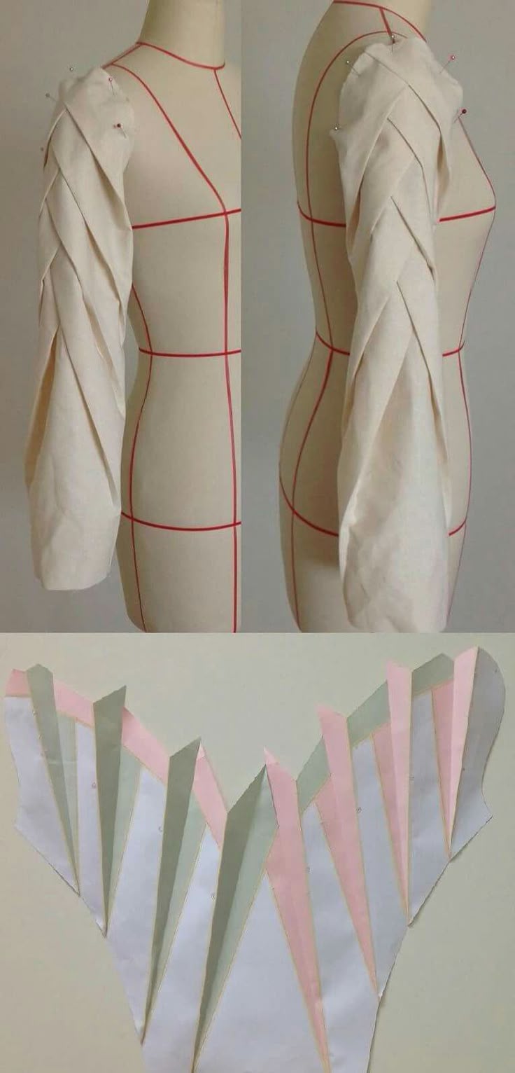 the image shows a dress form with a sleeve designed with pleats and a paper pattern for the same sleeve. the dress form is plain and shows red lines marking the center front, center back, and other important measurements. the sleeve on the dress form is pinned to the shoulder. below the dress form is a paper pattern with strips of colored paper to show the pleating design.