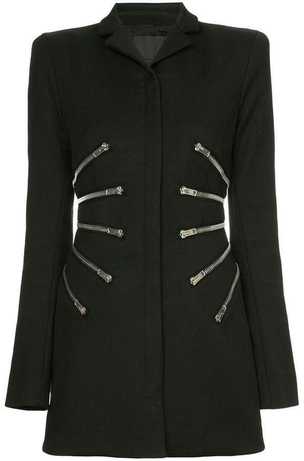 a black coat with silver zipper detailing on both sides. the coat has long sleeves, a collared neckline, and is a solid black color. the zippers are positioned in a parallel design down the front of the coat.