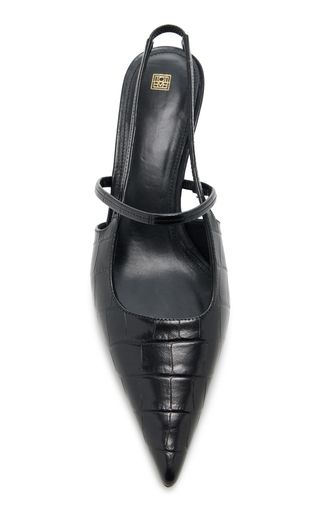 a pair of women's black leather pointedtoe heels with a slingback strap. the shoes are made of a textured leather that resembles crocodile skin. they have a high heel and a pointed toe. the shoes are shown from a topdown perspective, so the sole and the back of the shoe are not visible. the brand label is visible on the inside of the shoe.