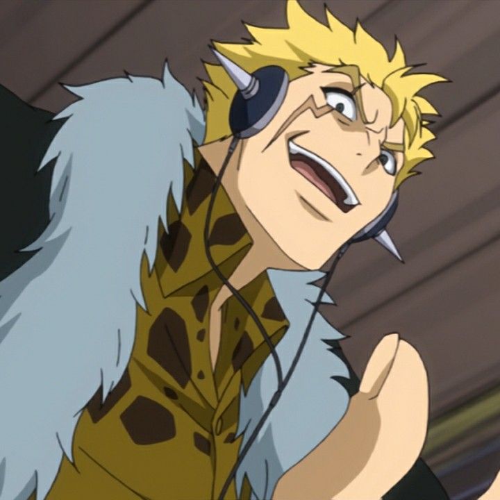 the image shows a male anime character with blond hair and a happy expression. he is wearing headphones, a furry collar, a leopard print shirt, and a black jacket. the background is blurry.  the image is drawn in a cartoon style.
