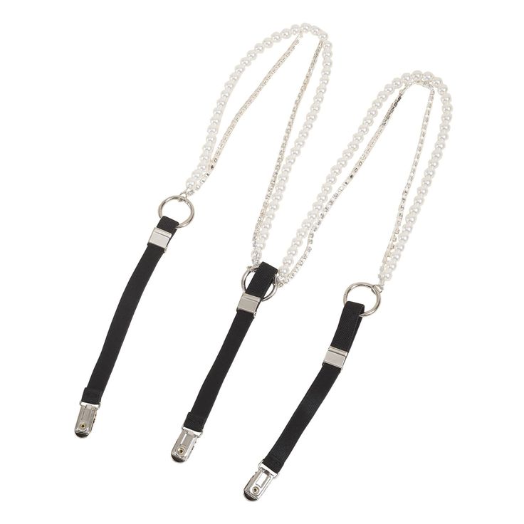 two pearl and metal straps with black elastic ends designed for holding garments or accessories. each strap features a double strand of pearls connected to a silver chain, a metal ring connector with a black elastic strap attached. the end of each elastic strap has a metal clip for secure attachment. the adjustable straps are likely meant to be detachable and used in fashion.