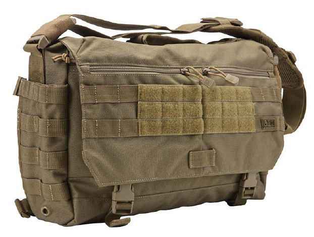 this is a closeup of a brown canvas messenger bag with multiple straps and buckles. the bag has a large flap that closes with a zipper. there is a molle webbing panel on the front of the bag. the bag is made of durable materials and appears to be wellmade.  it is likely designed for tactical use, such as carrying gear and equipment.