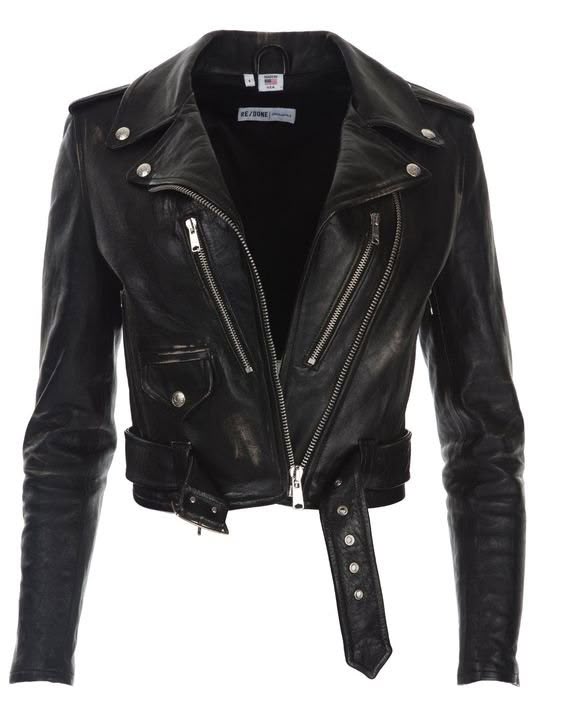 the image shows a black leather biker jacket. the jacket has an asymmetrical zip closure, a snapdown collar, and a belted waist. it has multiple pockets, including a small one with a snap closure on the chest. the lining is black. the brand label is visible on the inside collar. the jacket is isolated against a white background.