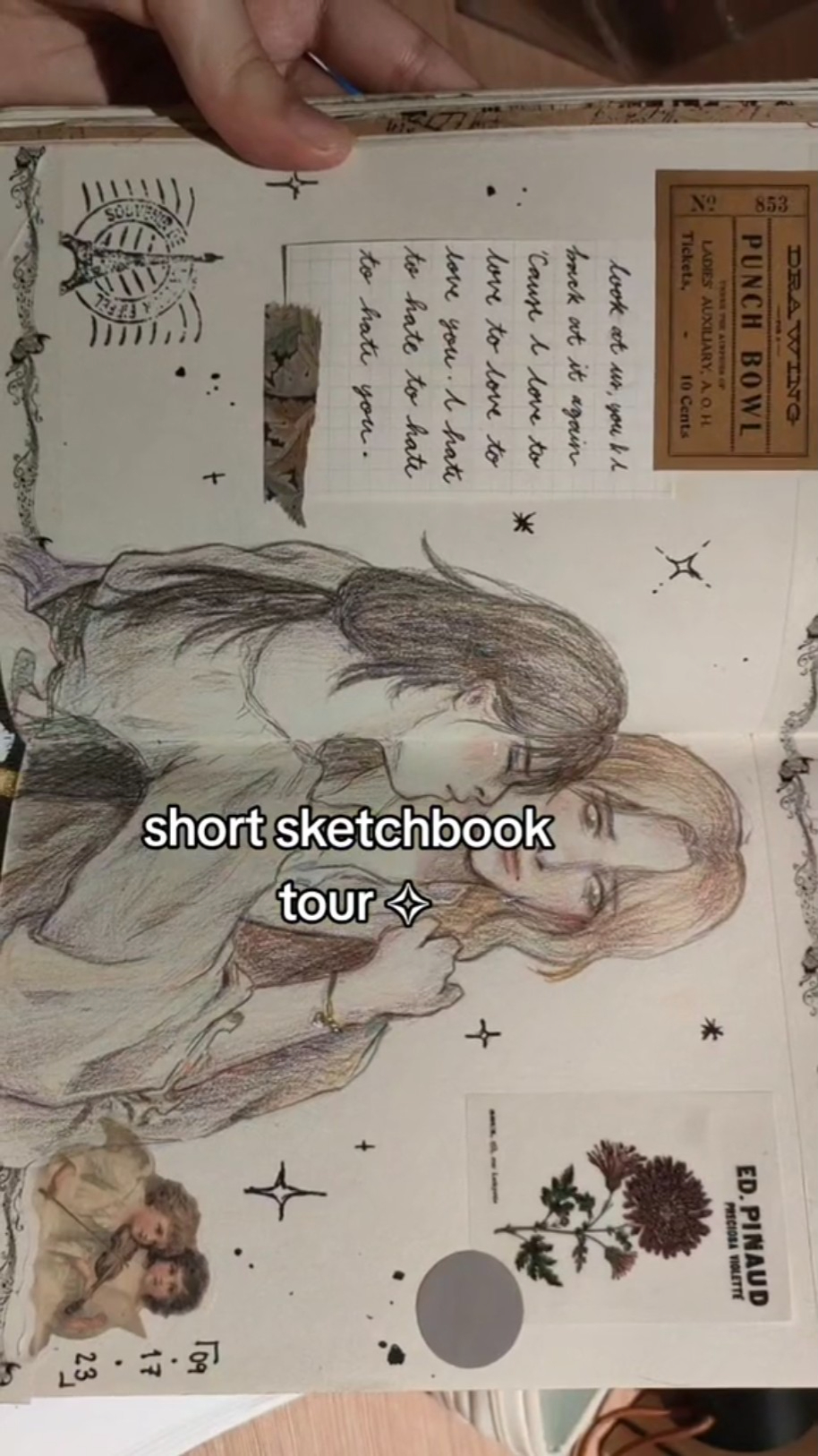 this image shows a closeup of a sketchbook, a tour of this book, which is the title of the post.  there are different drawings in it: a love quote, a flower, and an illustration of two women embracing. the page is decorated with stars and swirls, and has a label that says "punch bowl", a name of the book, and a small sticker from ed. pinaud. the handwriting in the quote is elegant and cursive, and the flowers are drawn in a detailed and realistic style. the image is a whimsical and romantic look into the pages of a sketchbook.