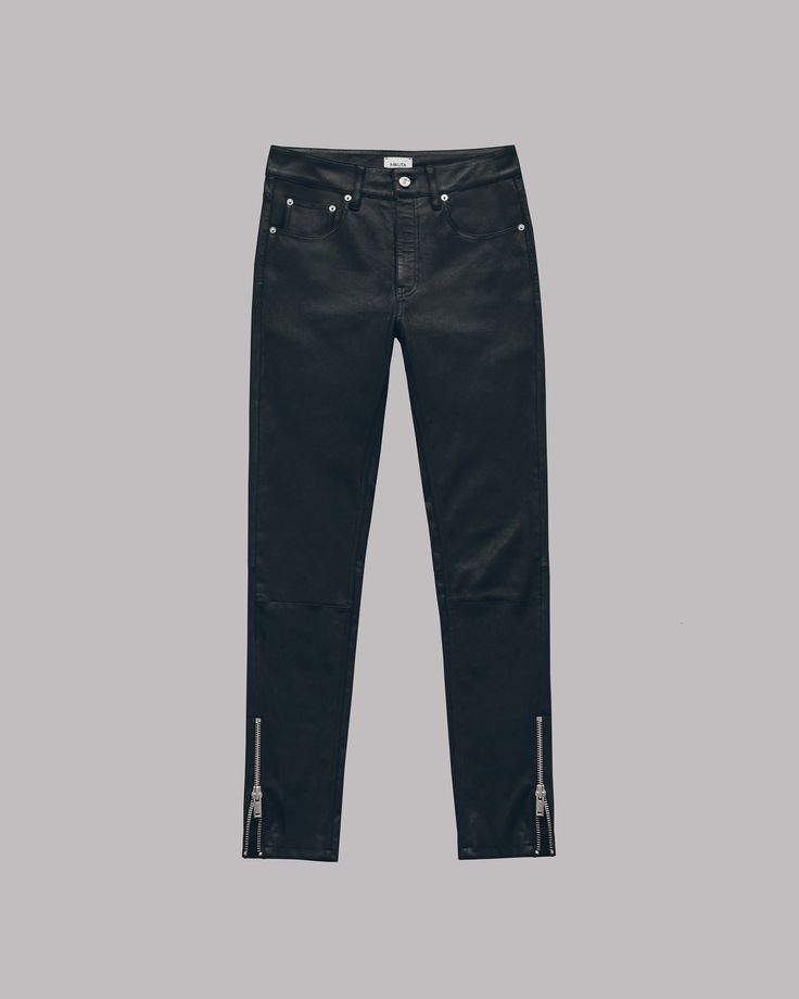 a pair of black skinny jeans with zippers at the bottom of the legs.