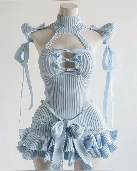 a blue dress with ruffles and a bow at the waist is being modeled by a woman. the dress is made of a soft, delicate fabric and has a very feminine look. the model is wearing the dress with confidence, and she looks beautiful and elegant.