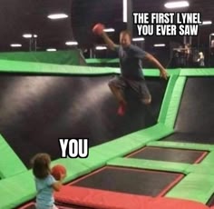 a man in a white tshirt and black shorts is jumping in the air on a trampoline. he's holding a red ball in his right hand and looks like he's about to throw it. behind him are two other trampolines. in the foreground is a young boy holding a red ball in his right hand.  the man is labeled "the first lynel you ever saw," and the boy is labeled "you".  this is a humorous photo showing a young boy trying to imitate the action of an older boy.