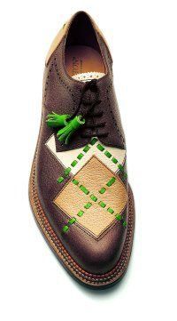 the image shows a single, closeup view of a stylish men's shoe.  the shoe is a brown leather brogue with a distinctive argylepatterned insert in beige and brown, accented with bright green stitching.  it features a classic laceup design and a tassel detail. the shoe appears to be handmade and highquality, with meticulous detailing visible in the stitching and leather work. the overall style suggests a blend of classic and contemporary design, possibly suitable for golf or other semiformal occasions. the background is simple white, focusing attention solely on the shoe itself.