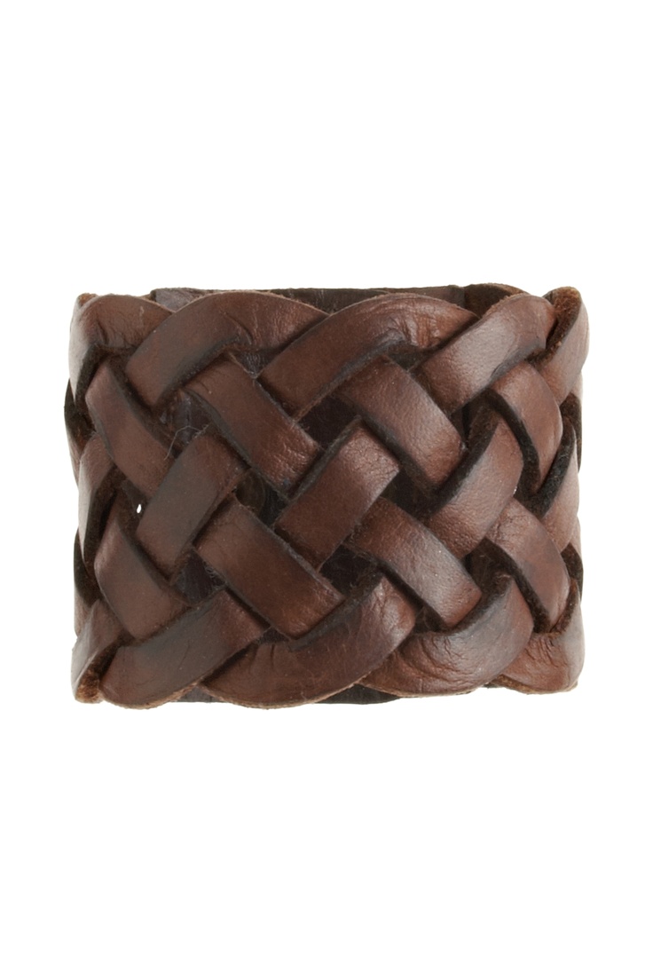 a closeup image of a brown leather woven bracelet isolated on a white background. the bracelet is made of multiple strands of leather that are woven together in a complex pattern. the leather is distressed, giving the bracelet a vintage look. the bracelet is shown from the top, so we can see the entire circumference of the bracelet.