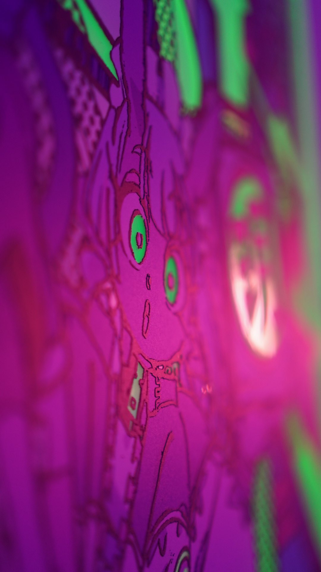 this image is a closeup of what appears to be a drawing on a blacklight poster. it features a cartoon girl with large green eyes and black and white clothing. the lines of the drawing are highlighted in bright green, pink, and purple. the overall aesthetic is very colorful and vibrant.