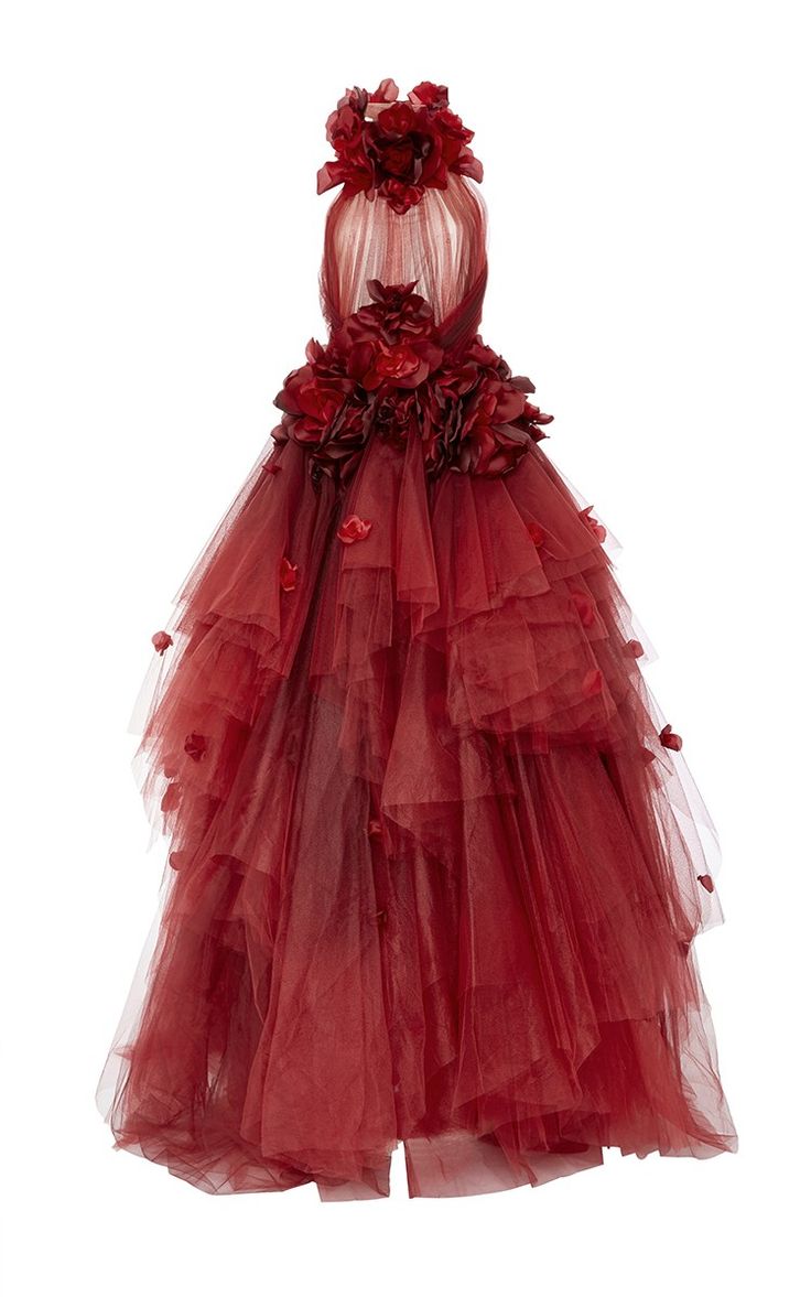 a red gown with floral embellishments and layered tulle skirt.