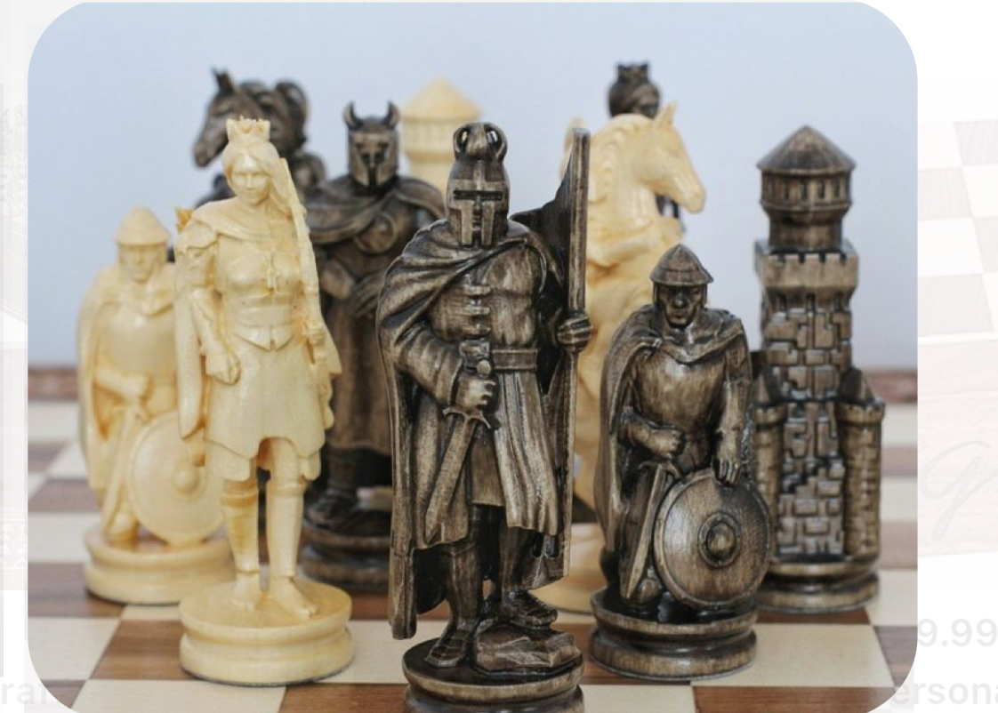 a closeup shot of a medievalthemed chess set arranged on a chessboard.  the pieces are intricately carved and show knights, a king, a queen, and a castle rook. the pieces are in contrasting light and dark brown colors.