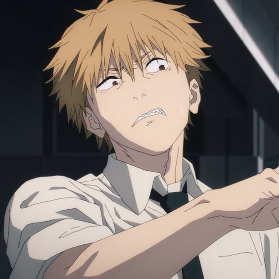 a closeup image of a young, blond anime man. he is wearing a white, collared shirt and a black tie. he appears distressed, with an intense expression, gritted teeth, and sweat droplets on his face. the lighting is dramatic, highlighting his clenched jaw and the tension in his arm. the setting appears to be a school hallway.