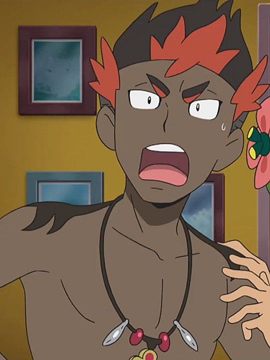 this is a close up cartoon portrait of an anime character.  he has dark skin, a red hair style and looks very surprised.  his eyes are wide open, his mouth is open, and his eyebrows are furrowed.  he's wearing a necklace with two pendants and a brown flower is near his ear. he has his arm raised and someone is lightly touching his shoulder. he is standing in front of a yellow wall with two picture frames in the background.