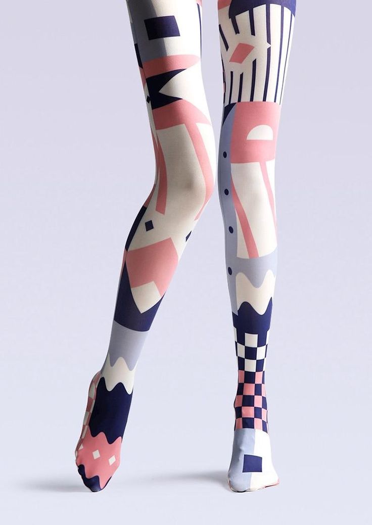 a closeup of a woman's legs wearing pink, blue, and white geometric patterned tights. the tights have a checkered pattern on the lower leg. the tights are stylish and modern.