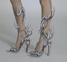 the image showcases a pair of women's legs adorned with intricately designed silver metallic high heels. the shoes boast a futuristic and fantasyinspired aesthetic, resembling an abstract, almost skeletal, structure. set against a plain background and illuminated with studio lighting, the image emphasizes the shoes' unique design and elegant style.