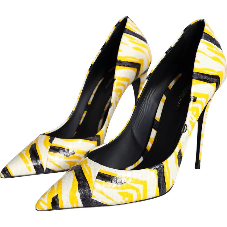 a closeup shot showcases a pair of women's highheeled shoes.  the shoes are pointedtoe pumps with stiletto heels. the shoes feature a striking abstract print in yellow, black, and white, reminiscent of an animal print such as snakeskin or zebra,  on what appears to be leather. the shoes are elegantly positioned, one slightly overlapping the other, highlighting their design and the quality of the materials. the inside of the shoes reveals a black insole, suggesting they are possibly a designer brand. the overall image conveys a sense of high fashion and luxury.