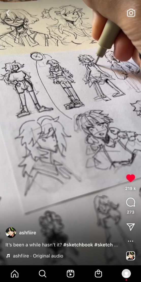 closeup video shows a hand sketching various animestyle characters in a sketchbook. the video is accompanied by text that says "it's been a while hasn't it? #sketchbook #sketch..." the artist's name, ashfiire, is displayed, along with a heart icon and comment count.  the sketches are in various stages of completion, ranging from initial outlines to more detailed renderings. the style is loose and expressive, with visible pen strokes. the background subtly shows more of the sketchbook pages.