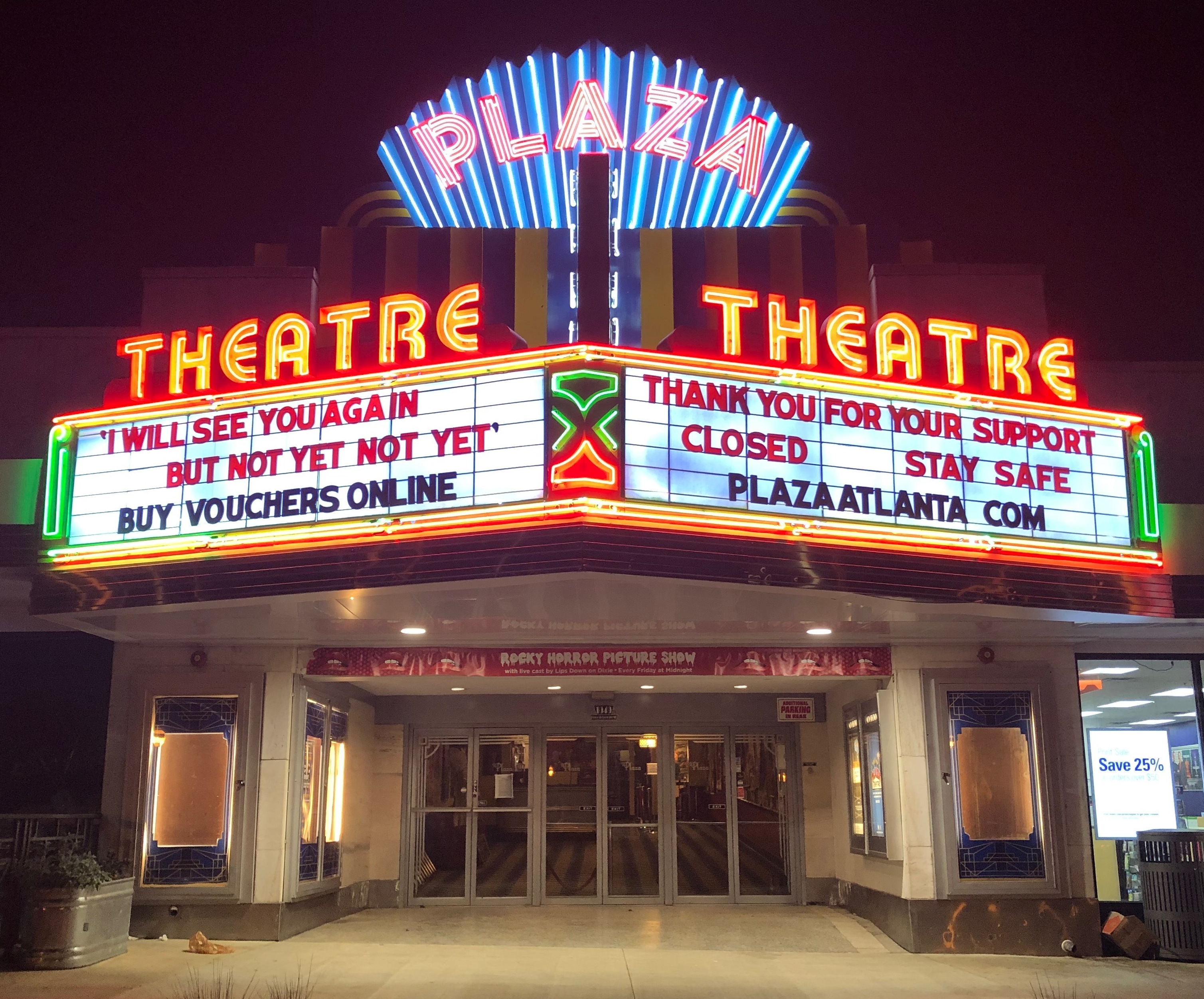 a photo of the plaza theatre in atlanta, georgia at night. the theater is closed and its marquee reads "i will see you again but not yet not yet buy vouchers online" and "thank you for your support closed stay safe plaza atlanta com".