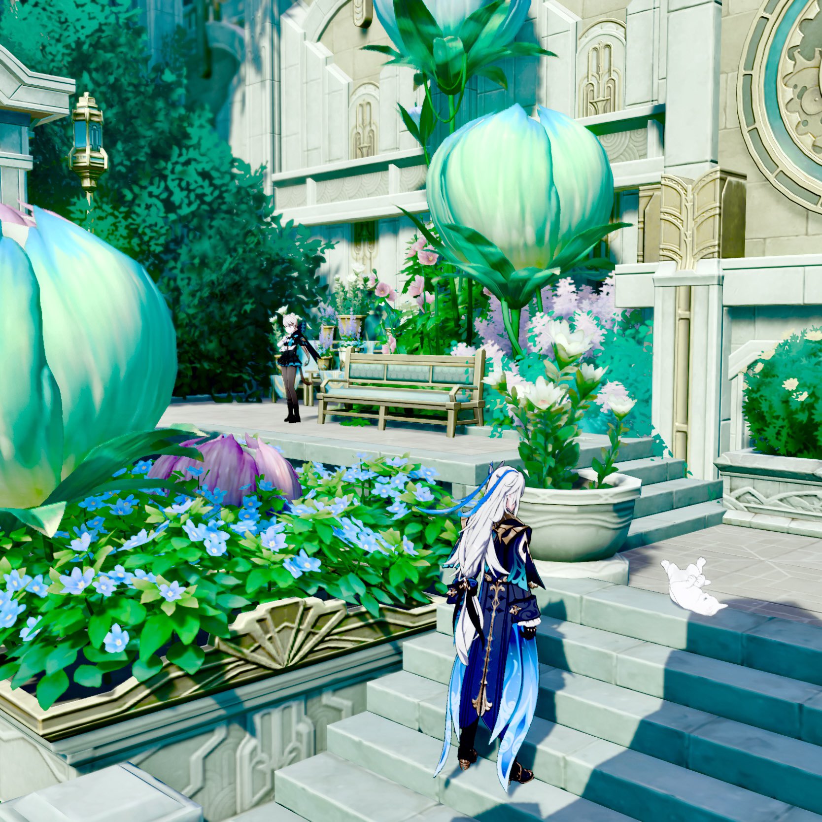 a screenshot from the video game genshin impact depicts a serene garden scene. two female characters stand near a bench in the background, while a male character is in the foreground.  the garden is lush with vibrant blue and green flowers, and large, unusual lightgreen flowerlike plants are prominently featured.  the architecture is lightcolored, seemingly made of stone or marble, and has a fantastical design. the overall atmosphere is peaceful and bright.  a small white object resembling a bird or animal is visible on the stairs. the scene is highly stylized, reminiscent of anime and fantasy art.