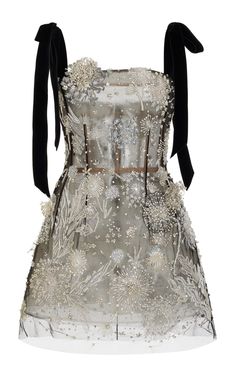 a silver and black beaded tulle dress with black straps. the dress is embroidered with silver flowers and sequins. it has a floral pattern.