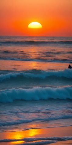 a wide shot of a beach at sunset. the sun is a large, orange orb setting over the horizon, casting a warm golden glow over the scene. the ocean is calm, with gentle waves rolling in towards the shore. a lone surfer can be seen in the distance, paddling out to catch a wave. the sand on the beach is wet and reflects the golden light of the setting sun. the sky is a mix of orange, red, and yellow hues. the overall atmosphere is one of peace and serenity.
