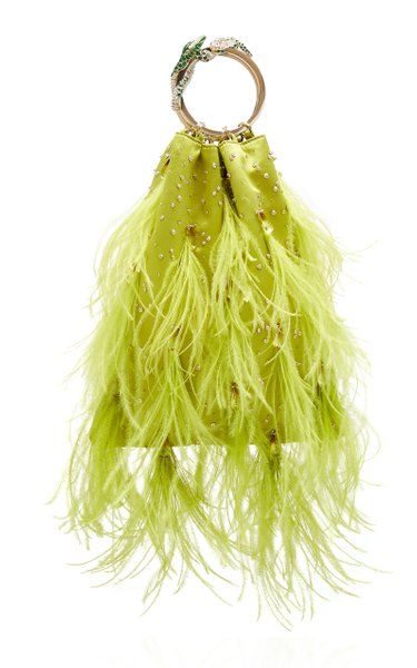 a vibrant green feather clutch handbag is displayed against a white background. the clutch features a gold handle adorned with a jeweled clasp. the feathery texture of the bag creates a sense of whimsy and luxury.