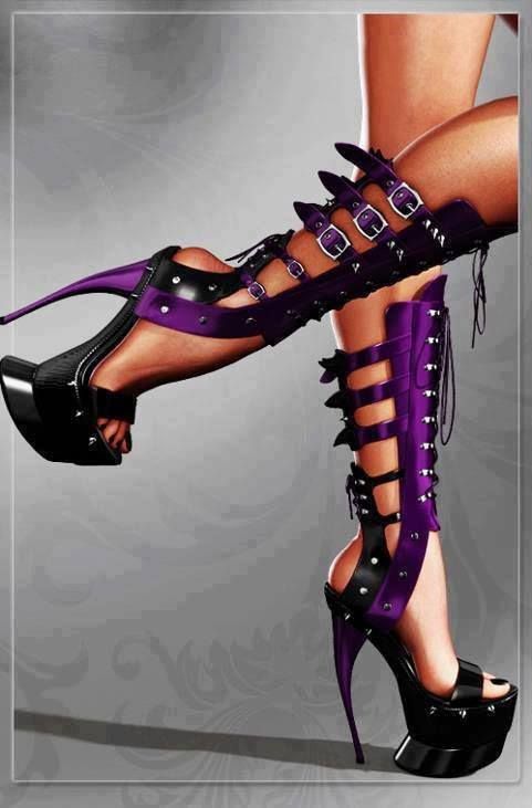 a pair of legs wearing purple and black platform high heels with gladiatorstyle straps.