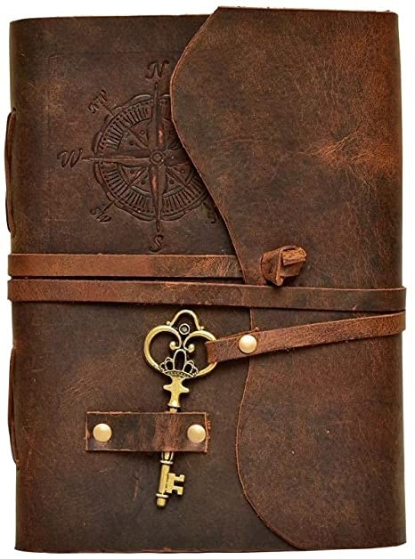 a brown leather journal with a compass rose design on the cover. the journal is secured with a leather strap and a key. the style is vintage and antique.