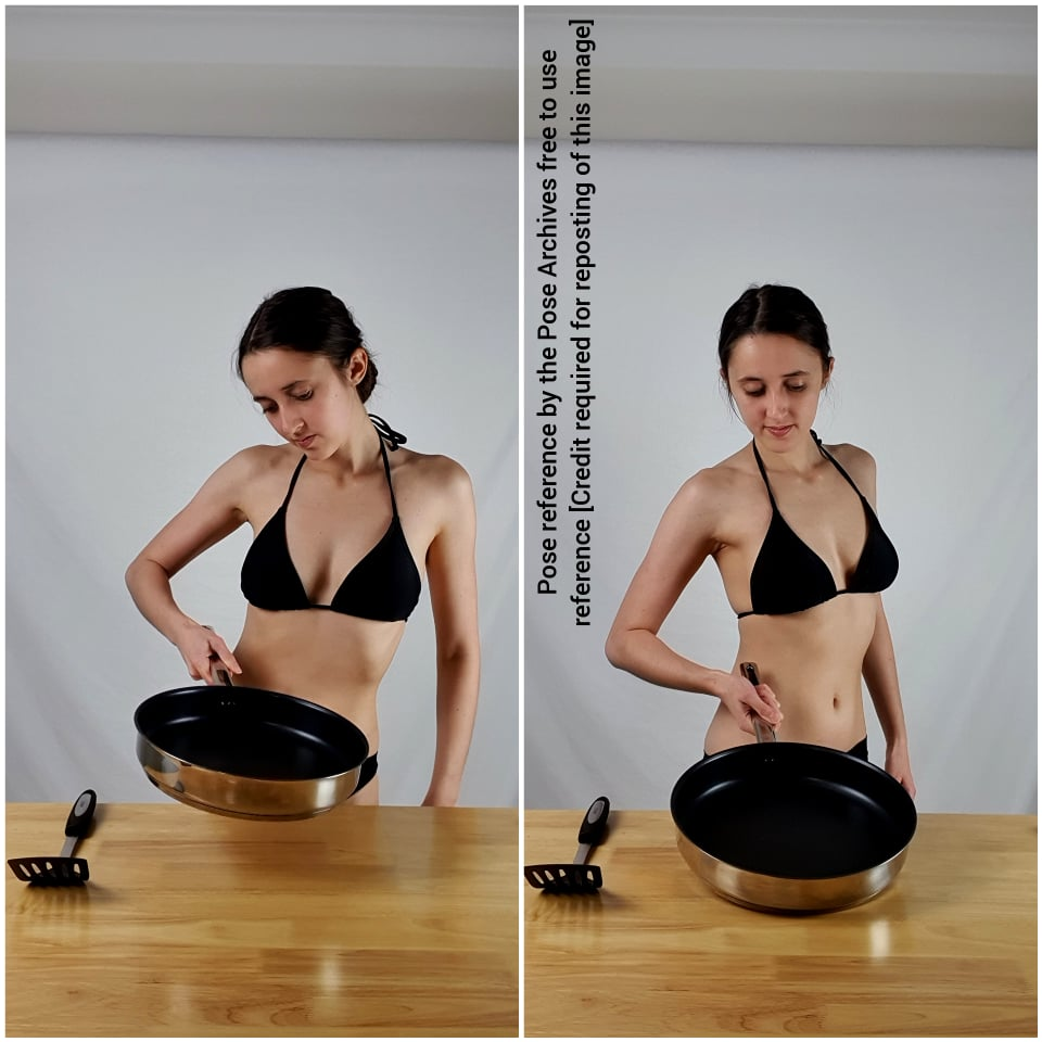 the image shows a woman in a black bikini top, standing in a kitchen setting. she is positioned beside a wooden countertop with a stainless steel frying pan and a spatula. the image is a pose reference, intended for artists, with the text indicating it's free to use with credit. ```