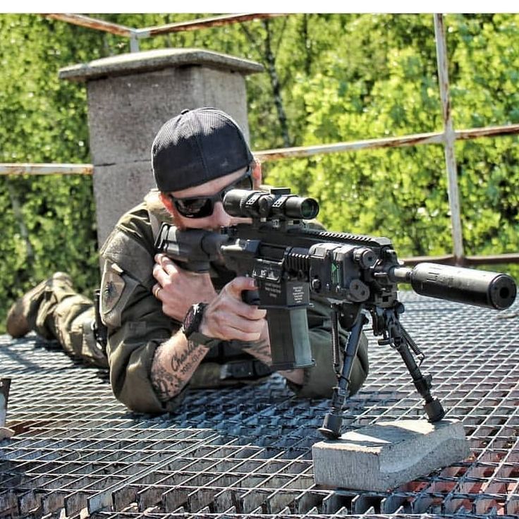 a soldier in camouflage fatigues