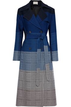 a blue and grey plaid trench coat with a double breasted closure and a belted waist. the coat is longsleeved and has a classic style. the coat is photographed on a white background.