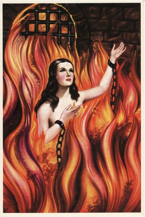 an illustration of a woman with black hair and fair skin is in the midst of large flames. the flames surround her and rise up to the top of the image, where there is a brick structure with a small barred window. the woman is wearing black cuffs around her wrists that are connected by a black chain. her gaze is turned upward, and she has a hand raised as though reaching up to something.