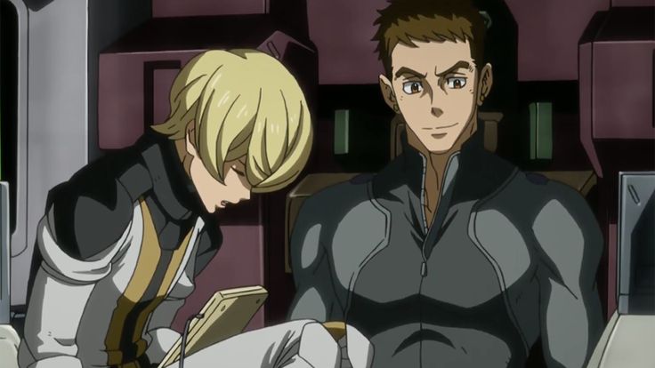 two anime characters in a futuristic setting,  the female on the left is looking down, the male on the right is looking forward. the woman has blond hair and a white suit with a yellow design. the man has dark hair and a dark suit. they appear to be in a spaceship cockpit with a futuristic background.