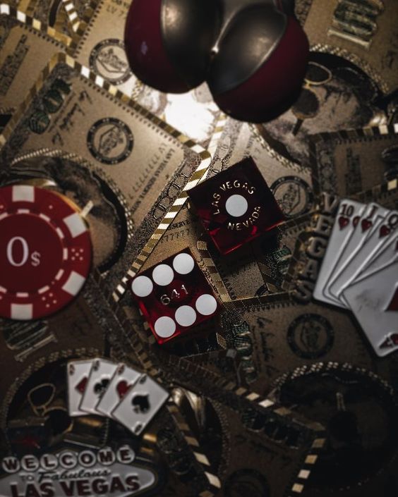 a closeup shot capturing the essence of gambling with a variety of casino elements scattered across the frame.  we see dice showing both winning and losing rolls, poker chips, playing cards, and stacks of money, all set against a backdrop of gold and black that evokes the glitz and risk of a casino.