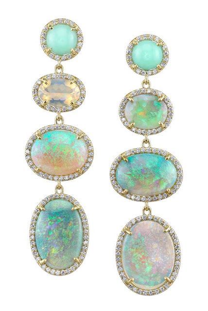 a pair of gold earrings with a variety of opals, each surrounded by small diamonds. there are three opals per earring, two green opals and one white opal.