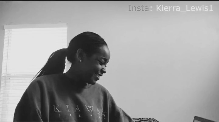 a black and white indoor shot of a smiling woman wearing a kiawah sweatshirt with her hair in a ponytail. her instagram handle is displayed in the upper right corner. a window with blinds is visible in the background.