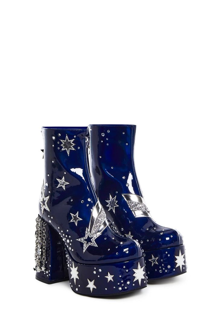 a pair of blue platform ankle boots with a star pattern. the boots have a chunky heel and are decorated with studs. they are arranged sidebyside against a white background.