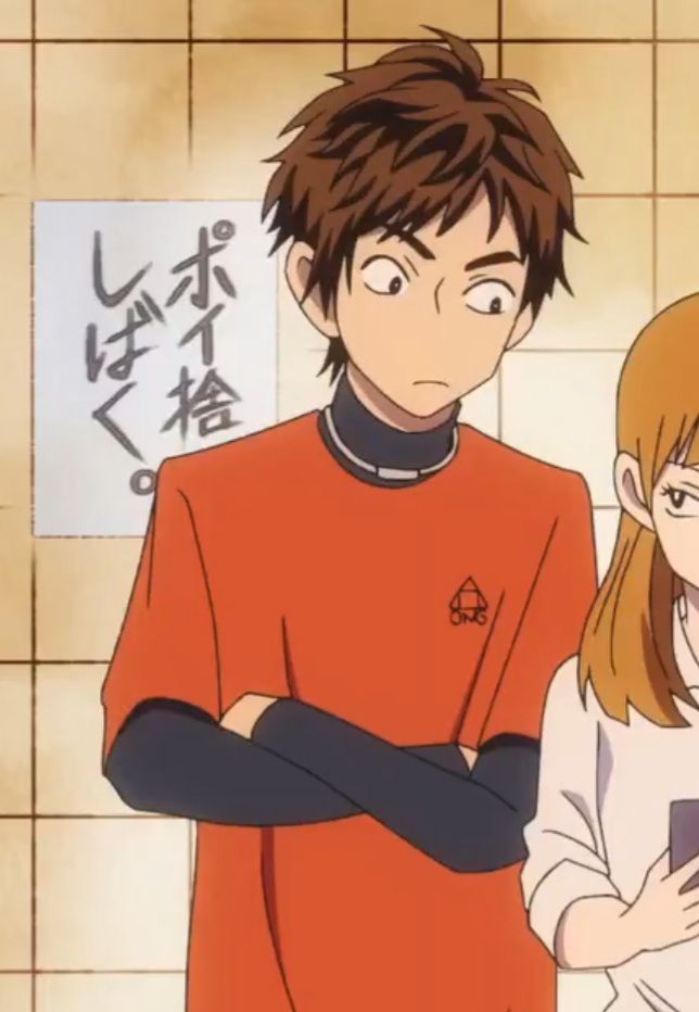 the image shows a close up shot of two anime characters. one is a male character with brown hair and black eyes, wearing an orange shirt with black arm sleeves and standing with his arms crossed. he has a serious expression on his face and appears to be looking towards the right side of the image.  the other character is a female, she has long, brown hair, and she's wearing a white shirt and looking at something offscreen.  they are standing side by side in front of a tiled wall with some japanese writing on it. the background is a tiled wall. the characters appear to be in a school setting.