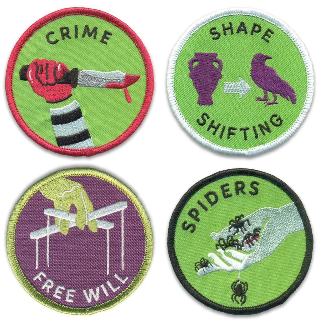 the image shows four round embroidered patches. the patch on the top left says "crime" and depicts a hand holding a knife with blood dripping from it. the patch on the top right says "shape shifting" and shows a vase transforming into a raven with an arrow indicating the change. the patch on the bottom left says "free will" and depicts a hand controlling puppet strings. the patch on the bottom right says "spiders" and shows a hand holding several spiders.
