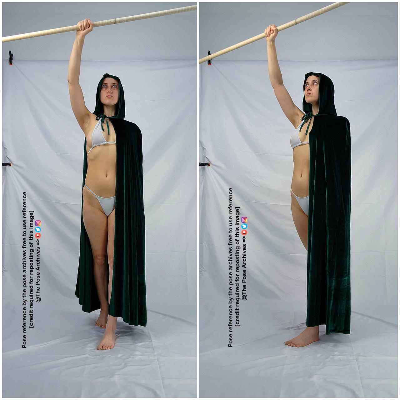 a woman in a dark green cloak and a light grey bikini stands against a white backdrop with a wooden pole in her right hand. she's posing for a reference photo with her head turned slightly to her right and her gaze upwards. this appears to be a reference image for artists.