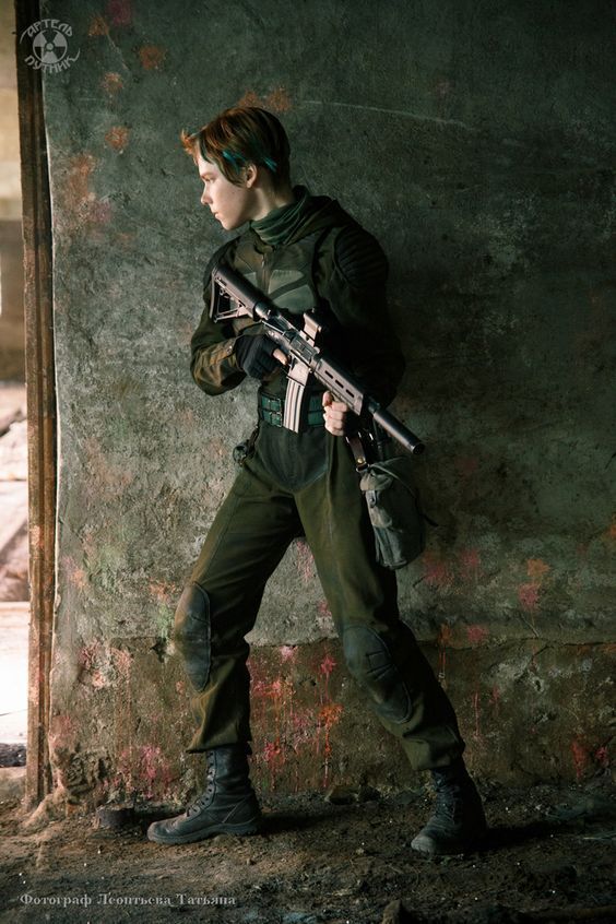 a woman soldier dressed in camouflage clothing and gear, stands ready with her weapon in hand in the ruins of a building. she is focused and determined.  the image has a gritty and apocalyptic feel.