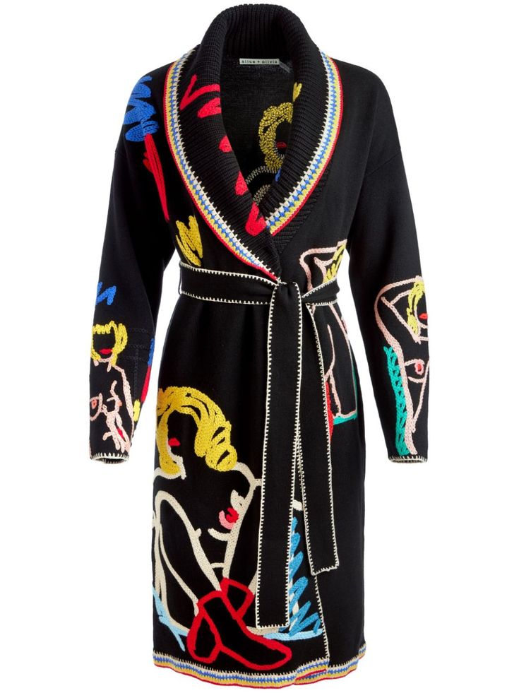 a black longsleeve knitted cardigan robe with colorful embroidered women's figures. the robe features a contrasting white trim around the collar, cuffs, and hem. the robe is tied at the waist with a black sash.