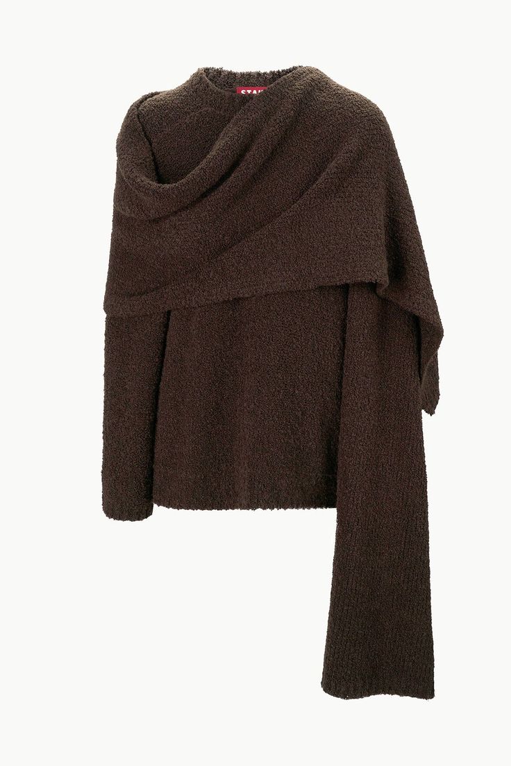 a brown, cozy oversized sweater with a cowl neck and long sleeves. the sweater is knit in a soft, fuzzy fabric and has a relaxed, comfortable fit. the sweater would be perfect for a casual day out or a cozy night in.