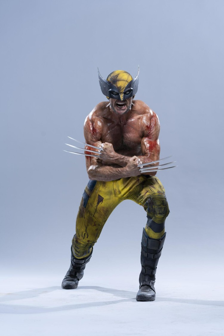 a fullshot image of wolverine, the marvel comics superhero, wearing his iconic yellow and black costume with his claws extended. he is posed in a dynamic, aggressive stance. he has a muscular physique.