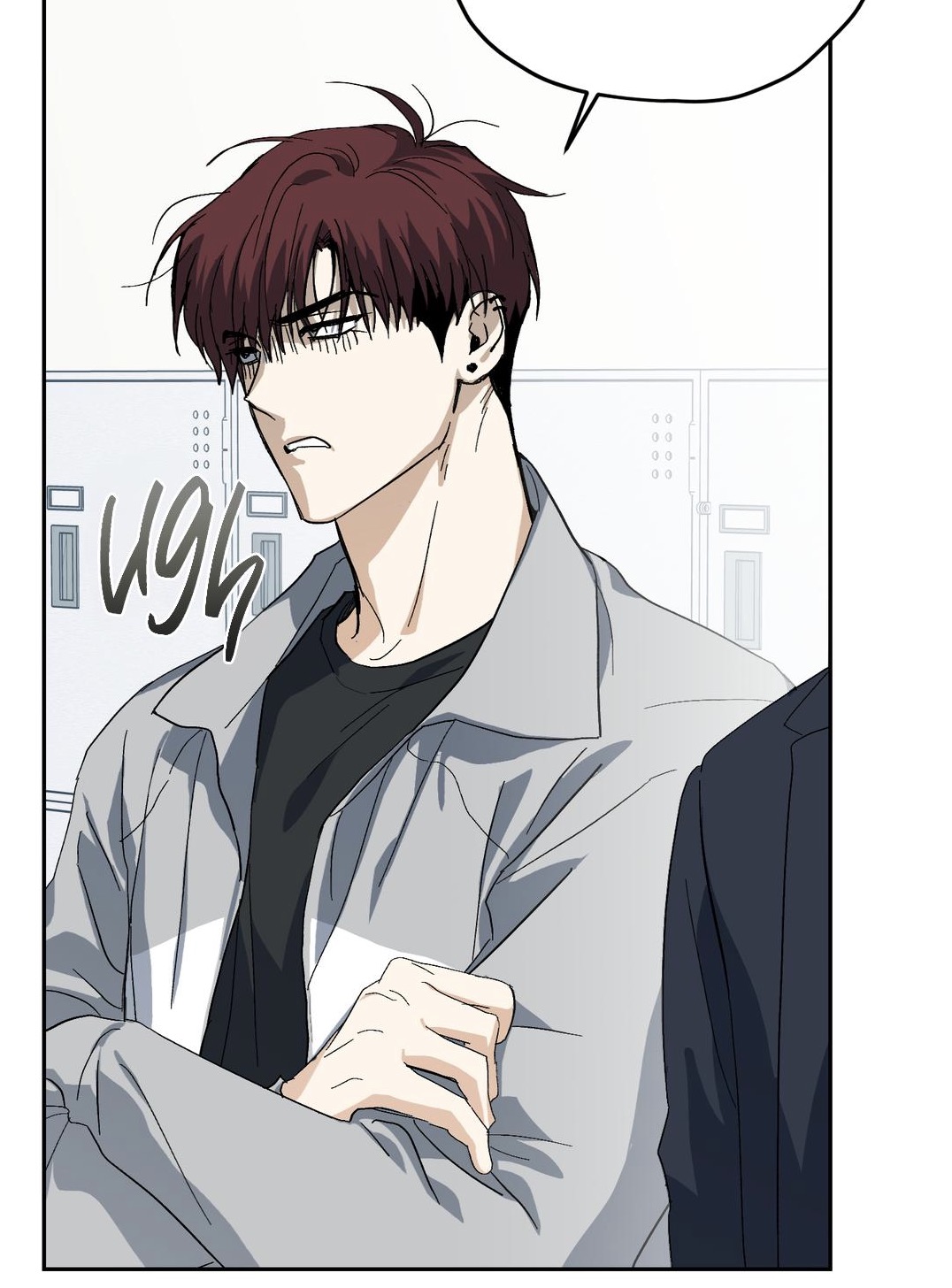 the image is a closeup panel from a manhwa (korean comic) or similar style webtoon.  it depicts a young adult male character with reddishbrown hair. he has a visibly annoyed or frustrated expression on his face, as indicated by his furrowed brows and downturned mouth. the word "ugh" is stylized and written near him. he is wearing a light grey jacket over a dark shirt. the background suggests he is standing in a school hallway with lockers visible. a portion of another person's dark suit is visible at the right edge of the panel.  the art style is clean and detailed, using a predominantly cool color palette. the overall mood is gloomy and tense.