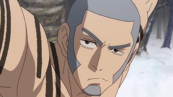 this closeup image features an anime man with a shaved head and tribal markings on his face and arm. he has a determined and serious expression, seemingly caught in a moment of action, possibly a fight. the setting appears to be outdoors, likely a snowy forest, indicated by the blurry trees and white ground in the background. the daylight illuminates the scene.